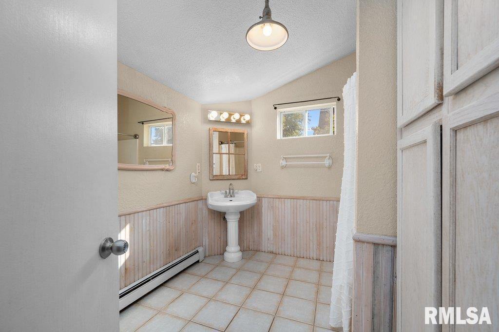 216 North Boss Street Kewanee, IL 61443 - Photo 15 of 36 a room with white cabinets and window