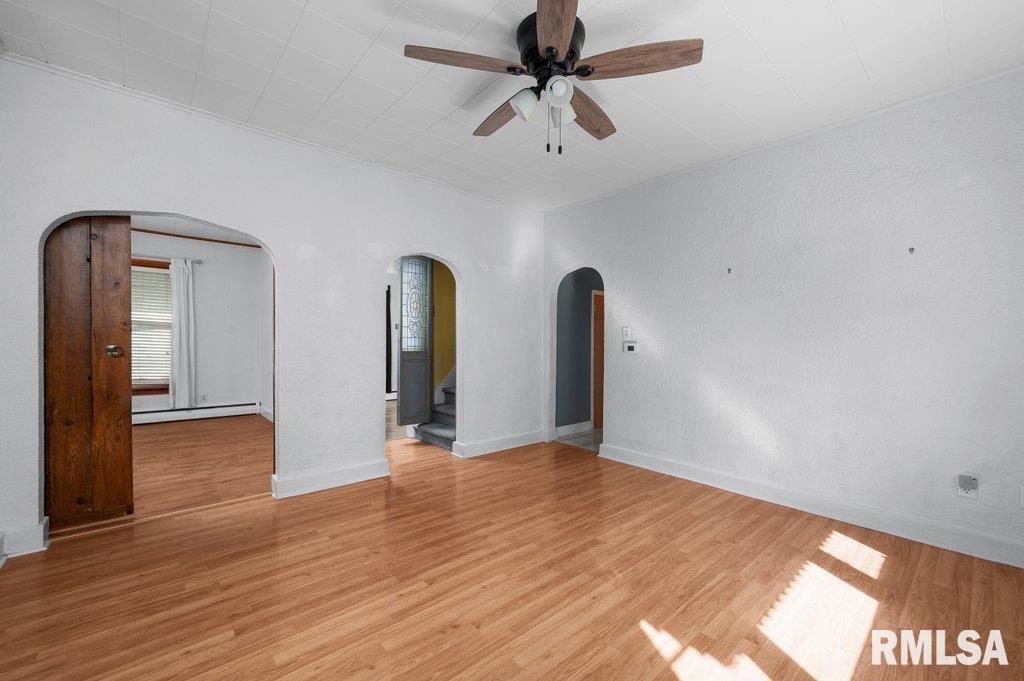 216 North Boss Street Kewanee, IL 61443 - Photo 18 of 36 a view of an empty room with window and wooden floor