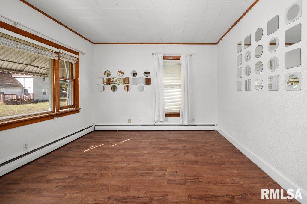 216 North Boss Street Kewanee, IL 61443 - Photo 20 of 36 a view of an empty room with window and wooden floor