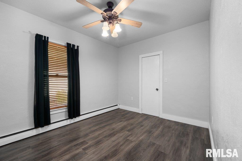216 North Boss Street Kewanee, IL 61443 - Photo 22 of 36 wooden floor in an empty room with a window