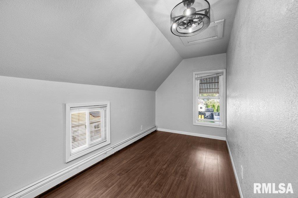 216 North Boss Street Kewanee, IL 61443 - Photo 25 of 36 an empty room with wooden floor cabinet and windows