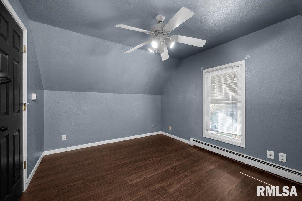 216 North Boss Street Kewanee, IL 61443 - Photo 28 of 36 an empty room with wooden floor fan and windows