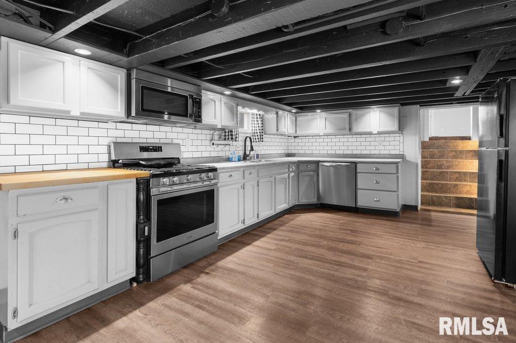 216 North Boss Street Kewanee, IL 61443 - Photo 3 of 36 a kitchen with stainless steel appliances granite countertop a stove sink and cabinets