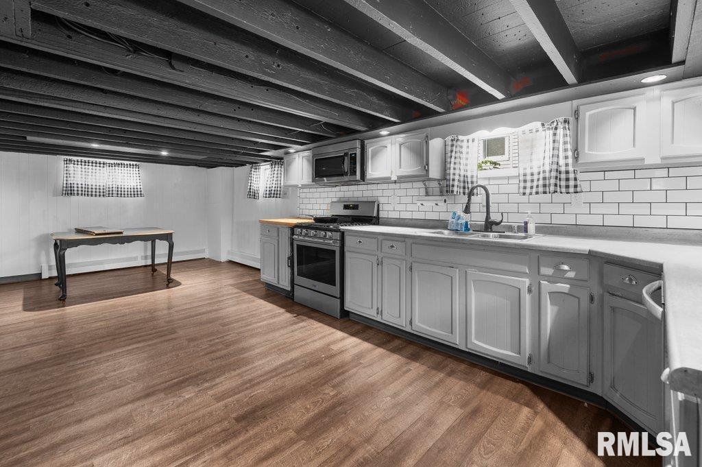 216 North Boss Street Kewanee, IL 61443 - Photo 4 of 36 a kitchen with granite countertop a sink cabinets and wooden floor