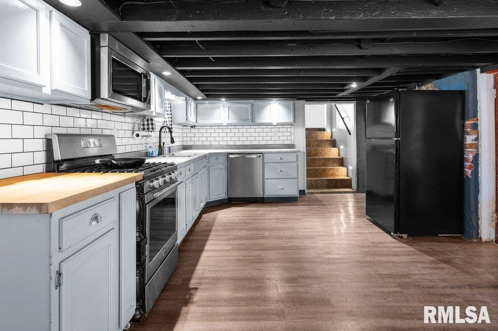 216 North Boss Street Kewanee, IL 61443 - Photo 6 of 36 a kitchen with a stove and a refrigerator