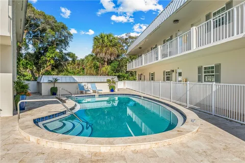 a view of a swimming pool with a patio