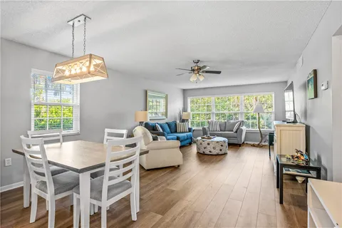 a view of a dining room with furniture window and outside view