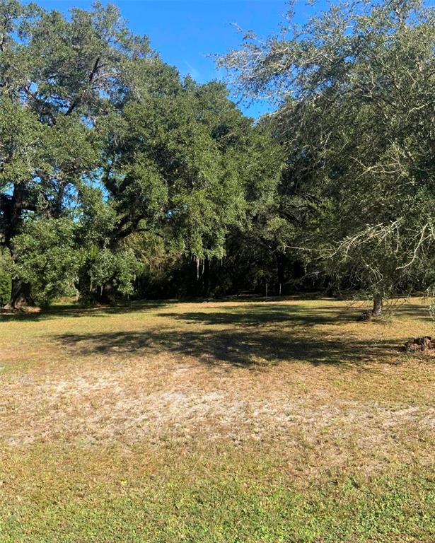 21426 Northeast 51st Avenue Earleton, FL 32631 - Photo 18 of 24 a view of a swimming pool with an outdoor space
