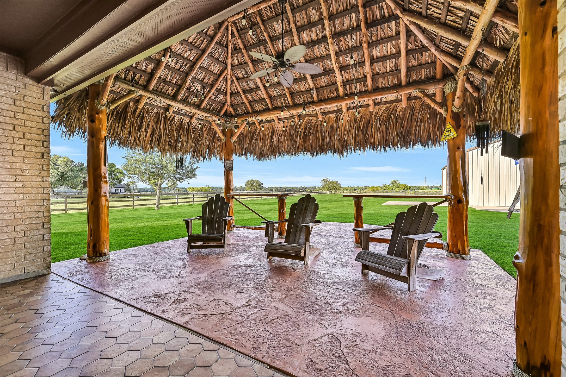 7611 Oak Alley Court Rosharon, TX 77583 - Photo 28 of 37 See incredible sunrises from this oversized back patio and palapa.