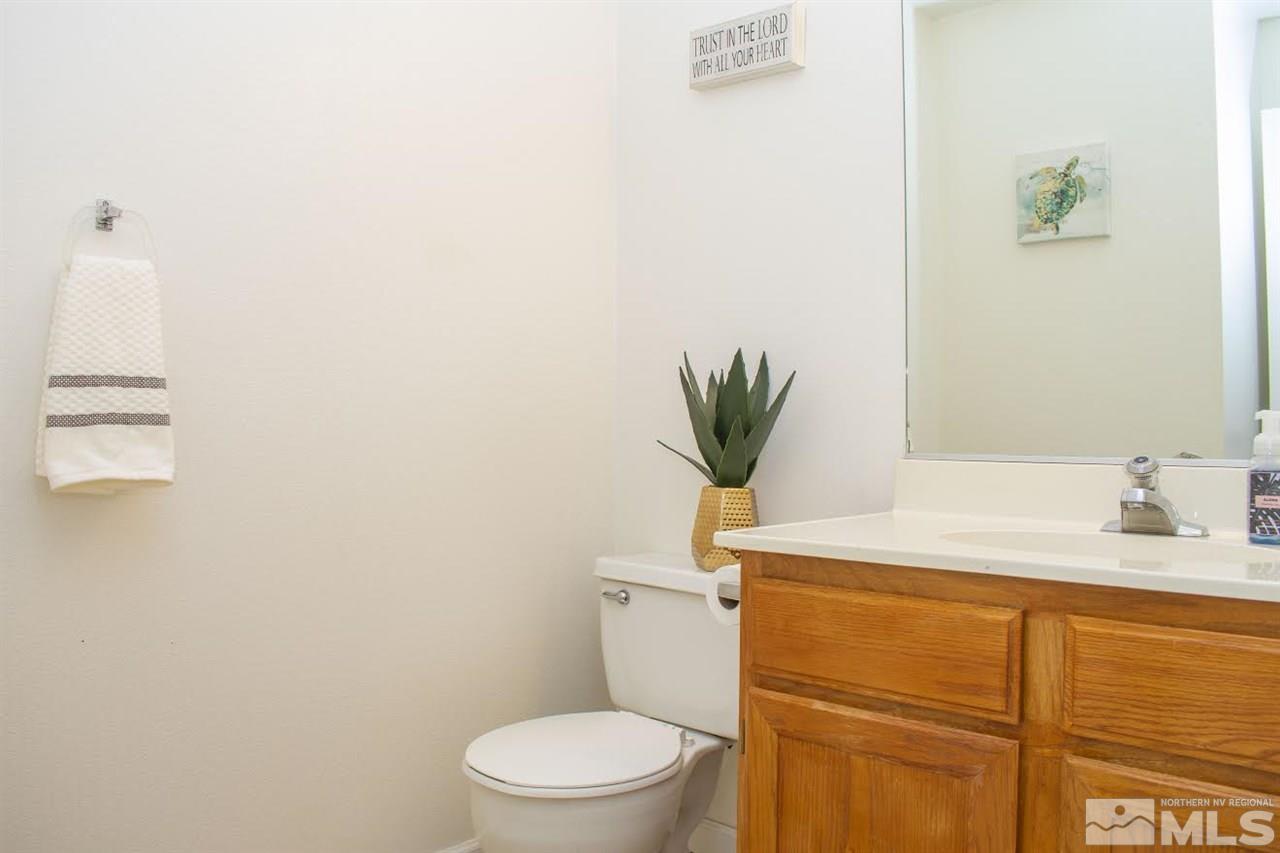 3969 Kings Row Reno, NV 89503 - Photo 6 of 14 a bathroom with a sink a toilet and vanity