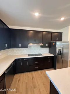 a bathroom with a sink and a large mirror