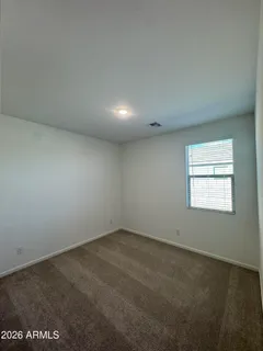 an empty room with a empty space and window