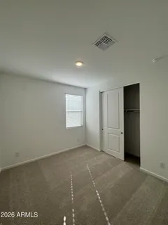 a view of an empty room and a window