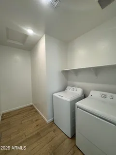 a utility room with dryer and washer