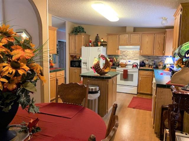 2537 Salt Pond Road Blue Ridge, VA 24064 - Photo 7 of 22 a living room with furniture a flat screen tv and a refrigerator