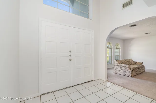 a room that has a couch and a chair in it