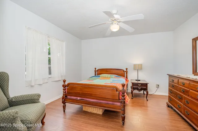 a bathroom with a sink a toilet and shower curtain