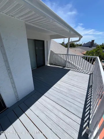 a dining room with furniture and a garden view