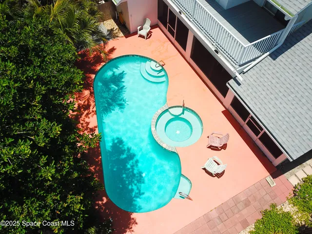 an aerial view of a swimming pool