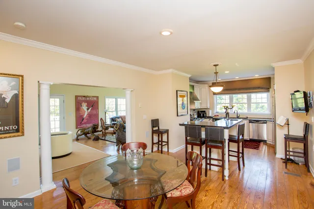 a kitchen with stainless steel appliances granite countertop a sink a stove a refrigerator and cabinets