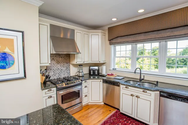a kitchen with a stove and a sink