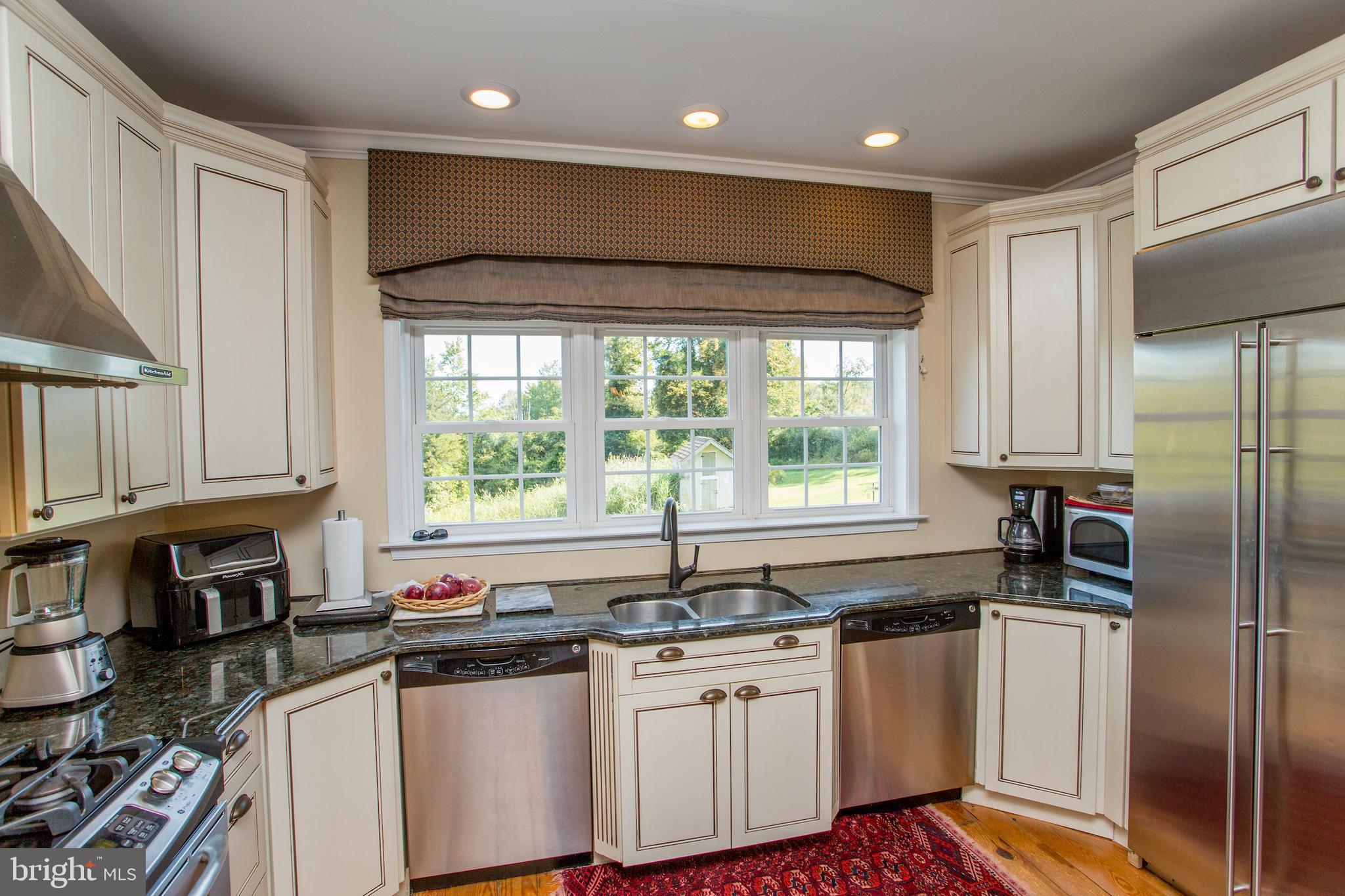3605 Windy Bush Road New Hope, PA 18938 - Photo 16 of 55 a kitchen with stainless steel appliances granite countertop a sink a stove a refrigerator and cabinets