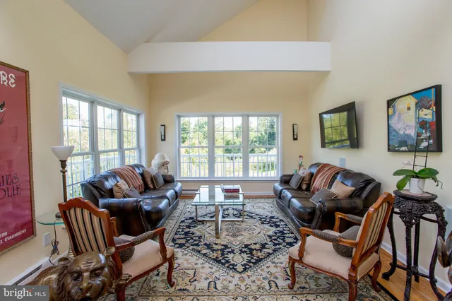 a view of a livingroom with furniture and wooden floor