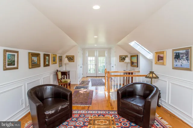 a view of a livingroom with furniture window and wooden floor