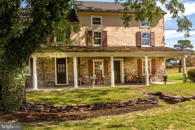 a kitchen with a sink window and cabinets