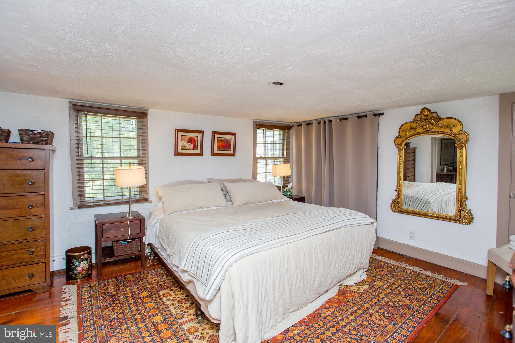 3605 Windy Bush Road New Hope, PA 18938 - Photo 41 of 55 a bedroom with a bed and wooden floor