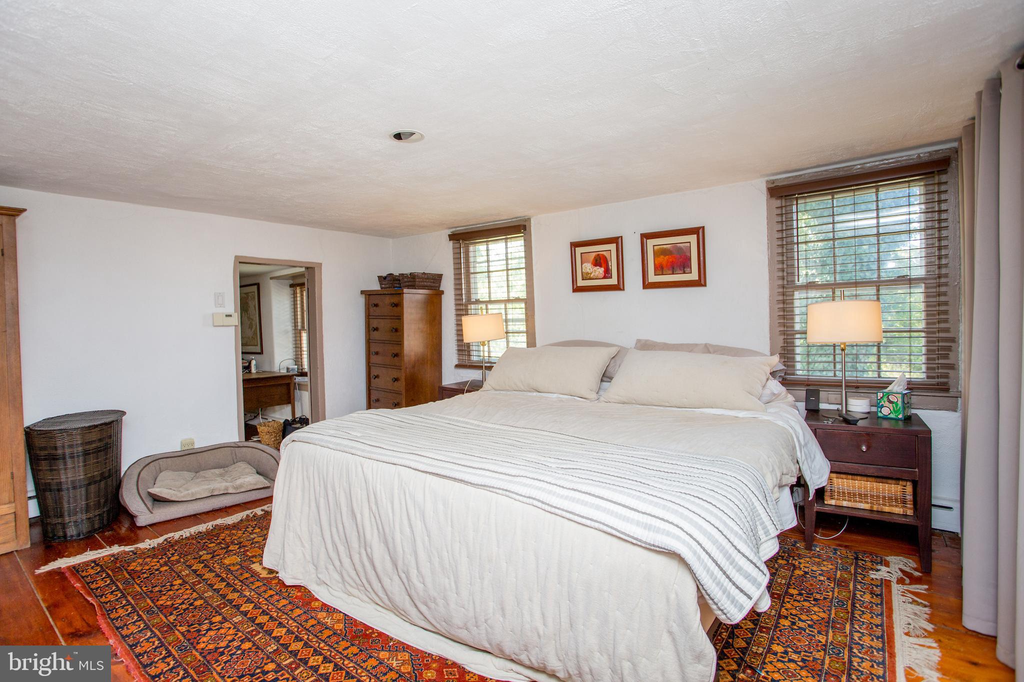 3605 Windy Bush Road New Hope, PA 18938 - Photo 42 of 55 a bedroom with a bed and wooden floor