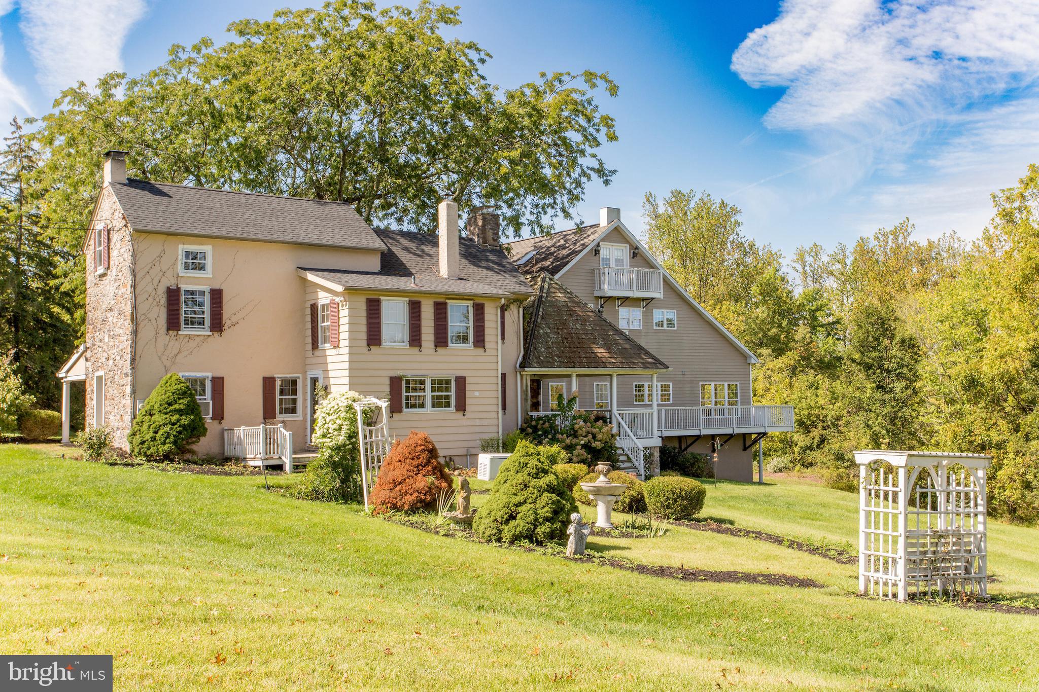 3605 Windy Bush Road New Hope, PA 18938 - Photo 46 of 55 a front view of a house with a garden