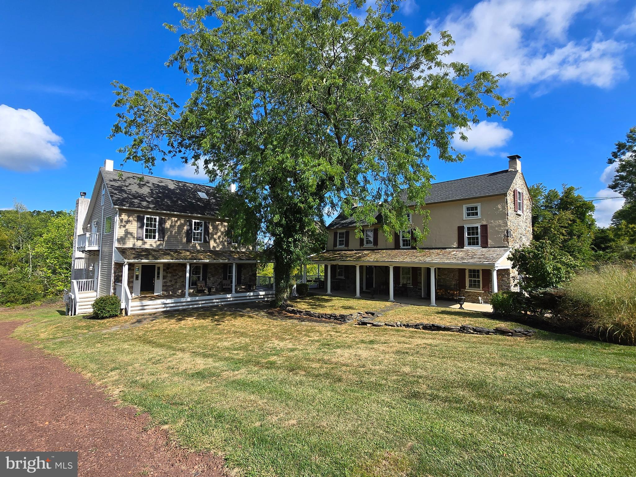 3605 Windy Bush Road New Hope, PA 18938 - Photo 5 of 55 a front view of a building with a garden