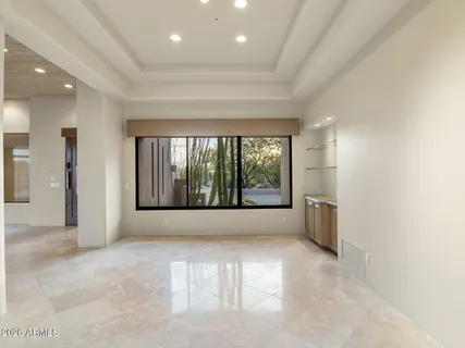 a view of an empty room with a balcony