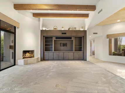 a kitchen with stainless steel appliances granite countertop a sink a refrigerator and a white stove