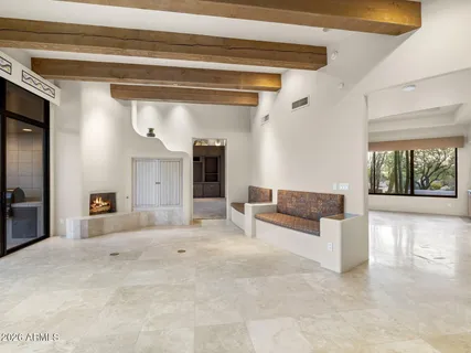 a living room with furniture and white walls