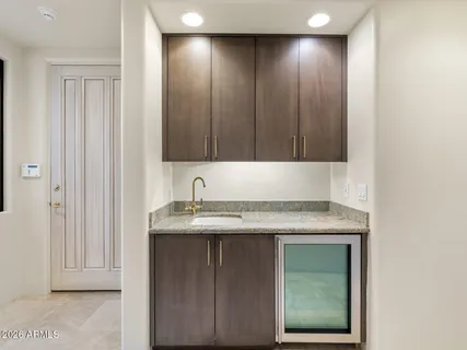 a kitchen with stainless steel appliances granite countertop a sink and a cabinets