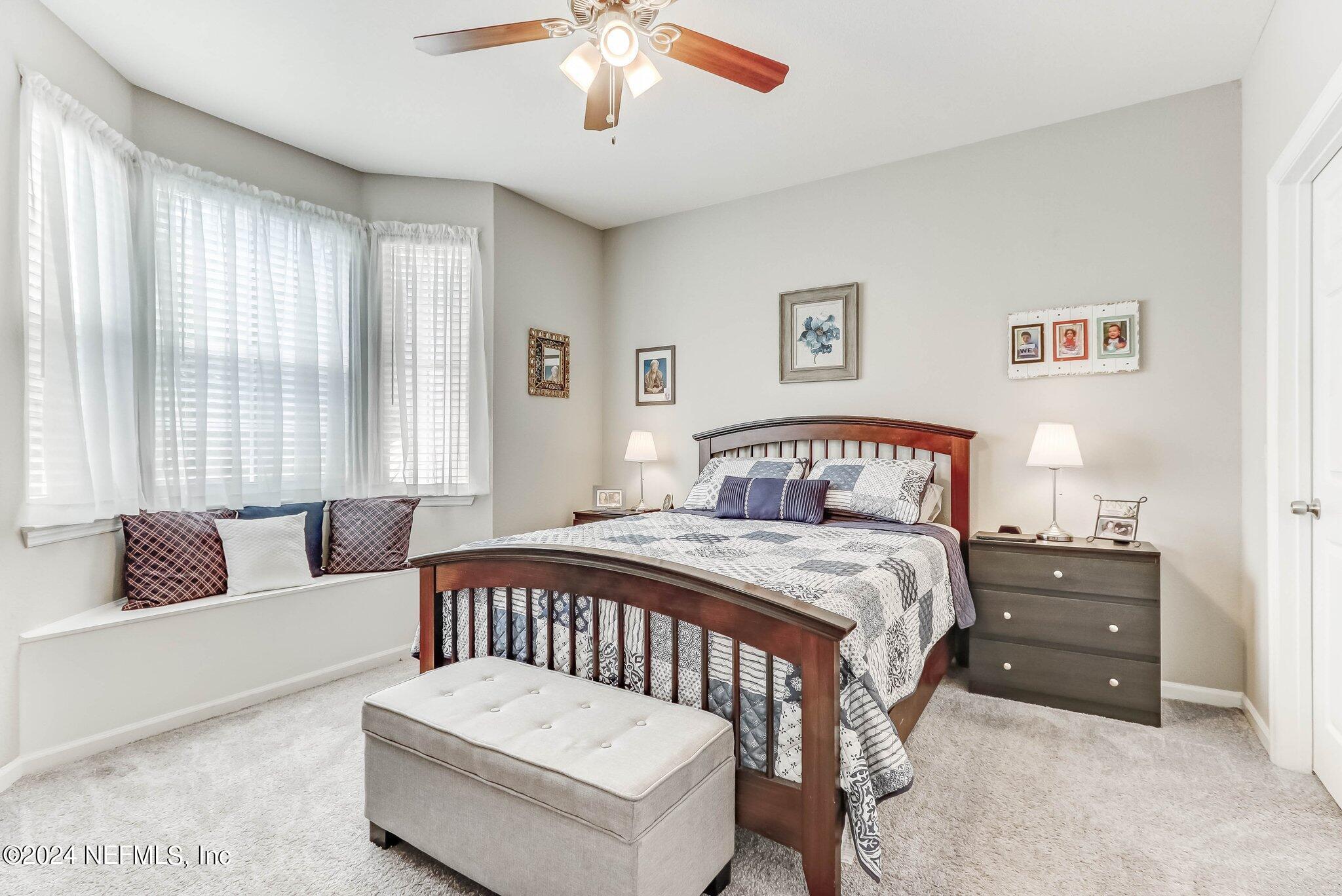 8550 Touchton Road, Unit 1423 Jacksonville, FL 32216 - Photo 13 of 36 a bedroom with a bed and a couch