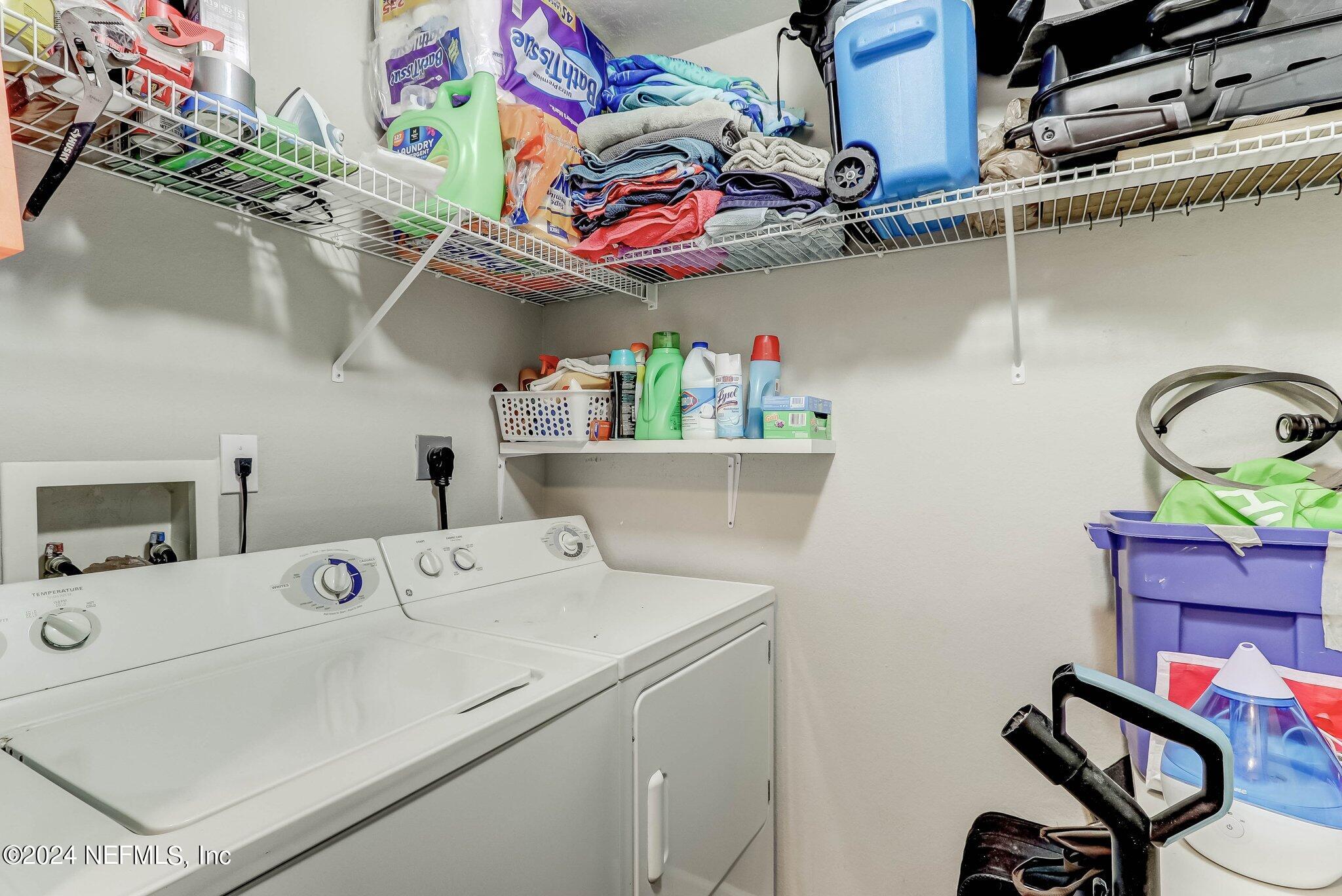 8550 Touchton Road, Unit 1423 Jacksonville, FL 32216 - Photo 18 of 36 a utility room with dryer washer and other items