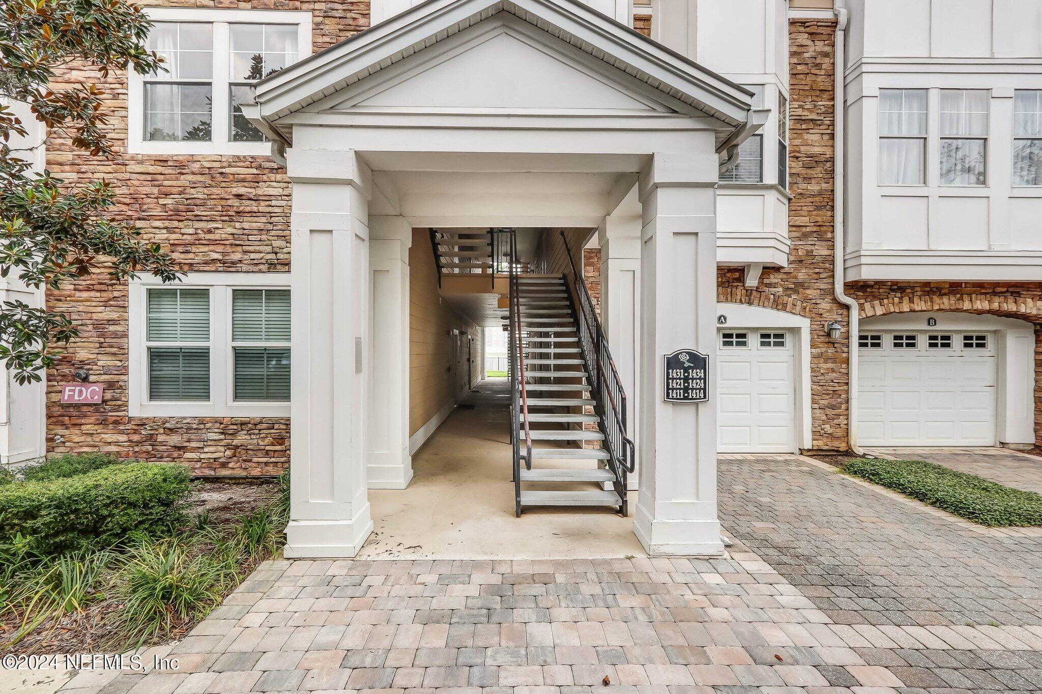 8550 Touchton Road, Unit 1423 Jacksonville, FL 32216 - Photo 19 of 36 a view of a house with more windows and brick walls