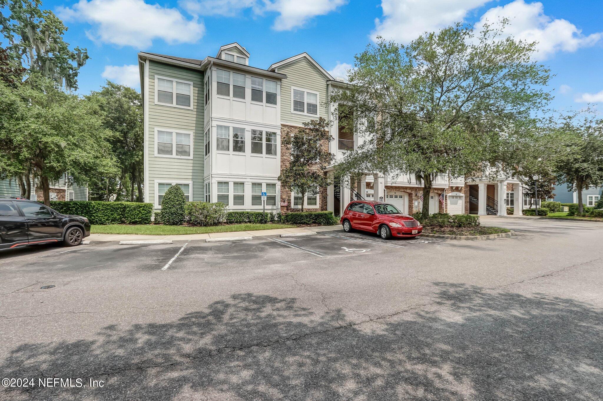 8550 Touchton Road, Unit 1423 Jacksonville, FL 32216 - Photo 21 of 36 a cars parked in front of a building