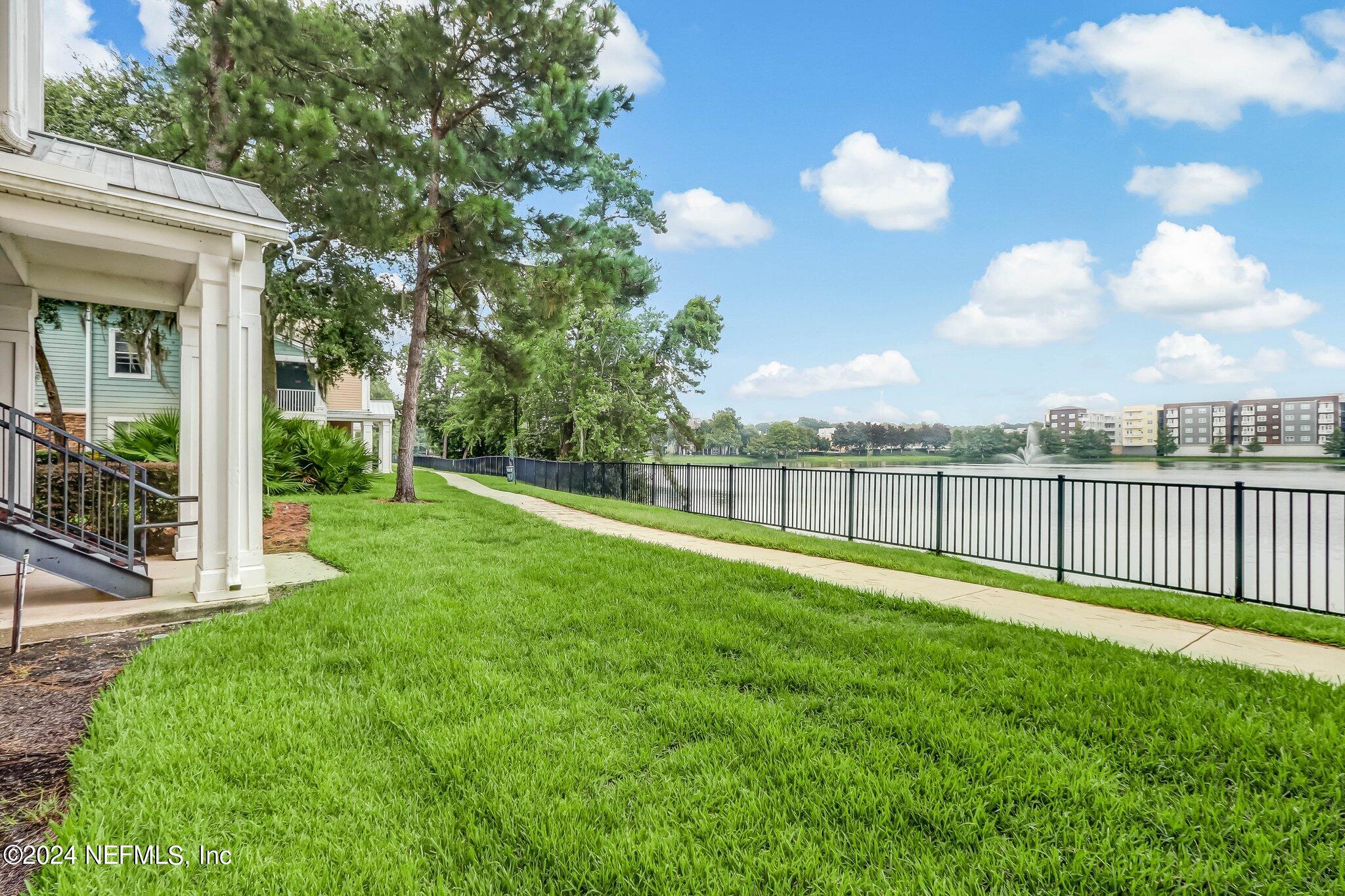 8550 Touchton Road, Unit 1423 Jacksonville, FL 32216 - Photo 23 of 36 a view of a deck and a yard