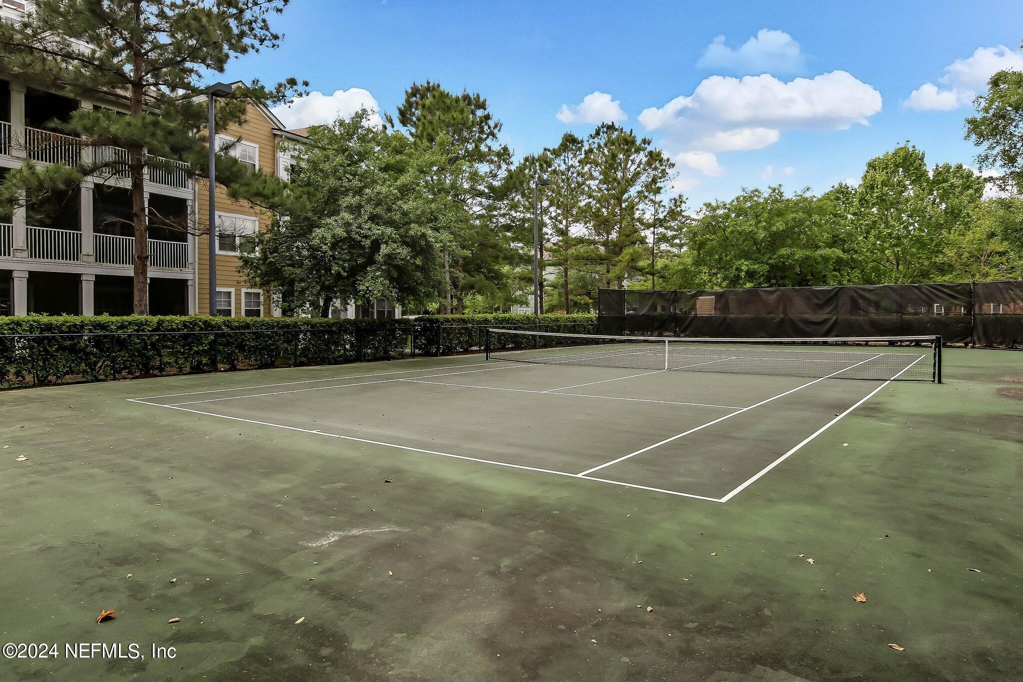 8550 Touchton Road, Unit 1423 Jacksonville, FL 32216 - Photo 32 of 36 a view of a tennis court