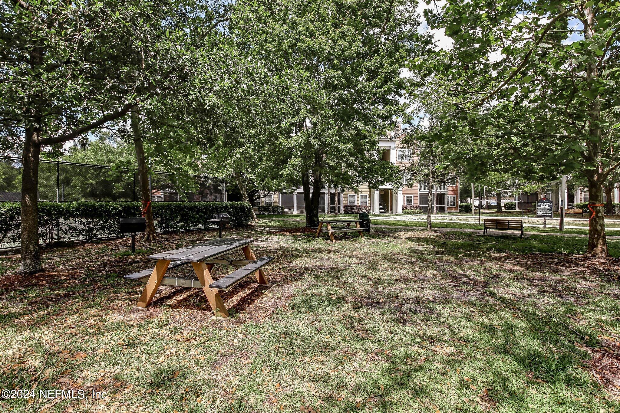 8550 Touchton Road, Unit 1423 Jacksonville, FL 32216 - Photo 33 of 36 a view of a park with wooden fence