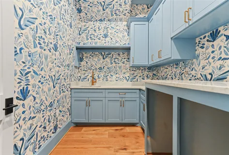 a spacious bedroom with a large bed a rug and a window