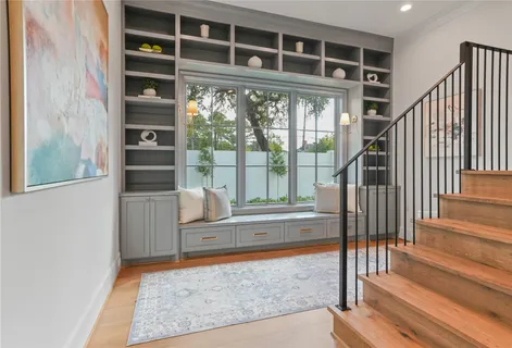 a bathroom with a granite countertop sink a toilet and a mirror