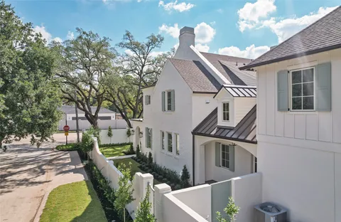 a view of a house with a chairs in patio