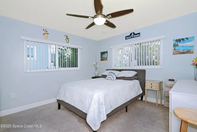 a bathroom with a granite countertop sink mirror vanity and toilet