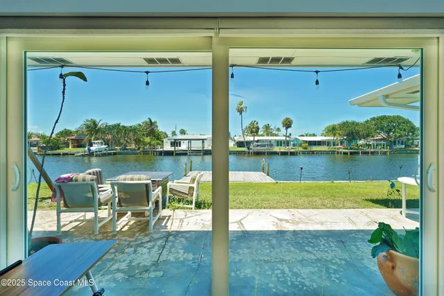 a kitchen with granite countertop a sink and cabinets