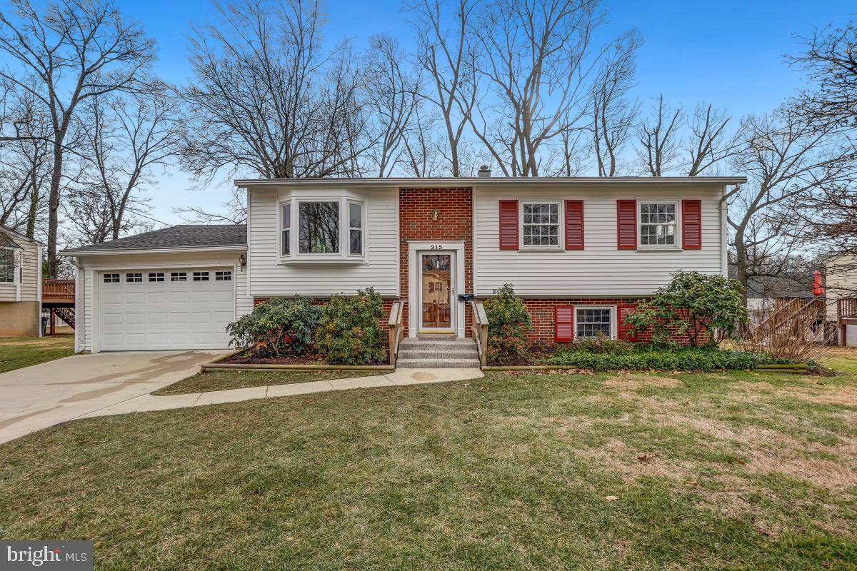 215 Rolling Road Gaithersburg, MD 20877 - Photo 1 of 31 a view of a house with a yard